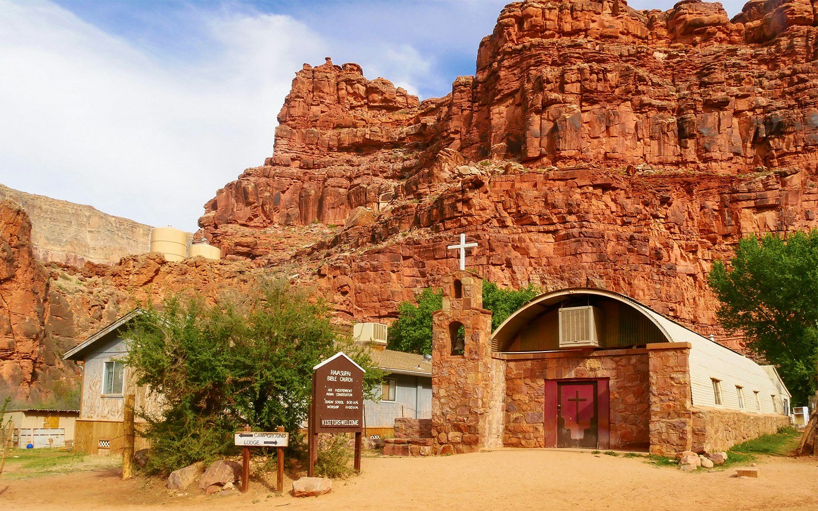Church in Supai Village, Havasupai Indian Reservation, Arizona, surrounded by red rock formations.