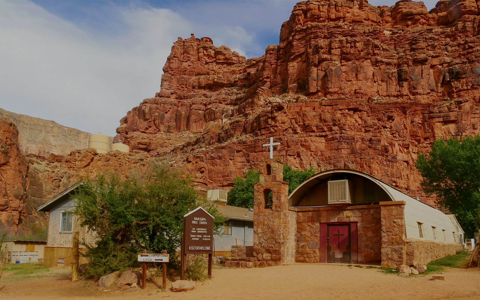 Church in Supai Village, Havasupai Indian Reservation, Arizona, surrounded by red rock formations.