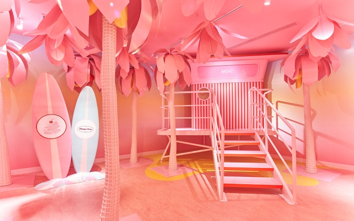 Museum of Ice Cream Singapore pink room with surfboards and palm trees.