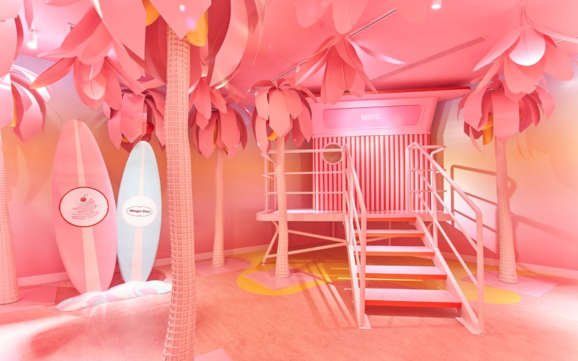 Museum of Ice Cream Singapore pink room with surfboards and palm trees.