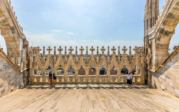 Milan Duomo rooftop with ornate spires and city view, part of skip-the-line tour.