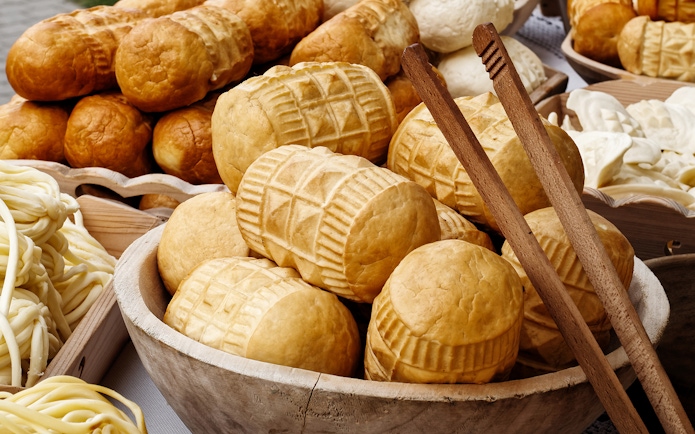 Traditional smoked cheese in wooden bowls, Zakopane day trip from Krakow.