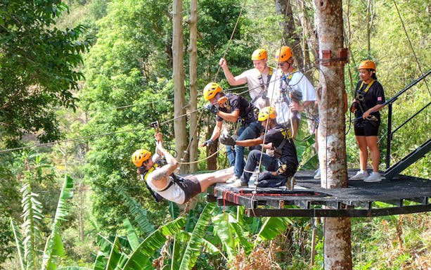 Participant ziplining to a platform, Zipline Adventure at Phuket Paradise Trip
