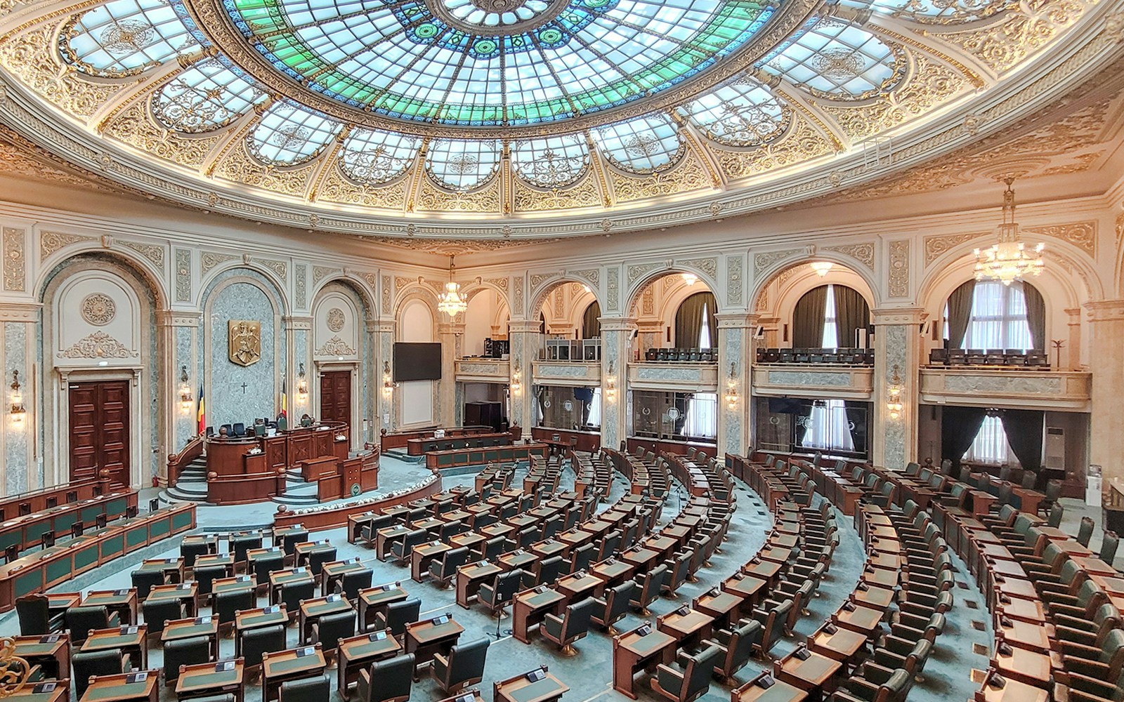 Parliament chamber with ornate ceiling inside Palace of Parliament, Bucharest.
