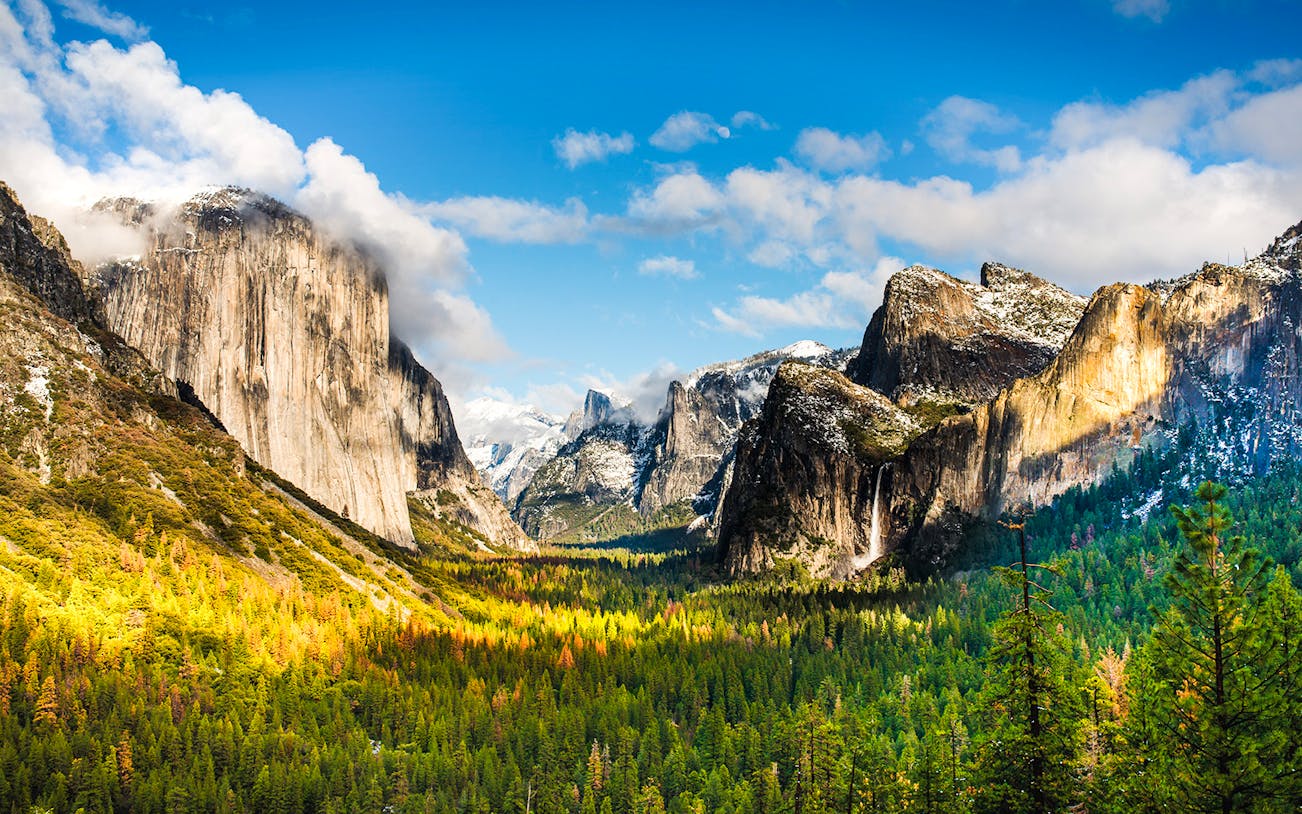 Tunnel View overlooking Yosemite Valley with Bridalveil Falls in the distance.