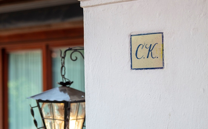 Tile with "C.K." initials on a wall at Museo Casa Kahlo, Mexico City.