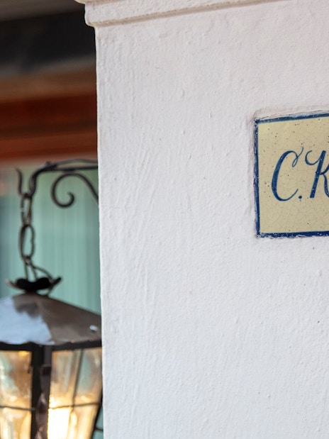 Tile with "C.K." initials on a wall at Museo Casa Kahlo, Mexico City.