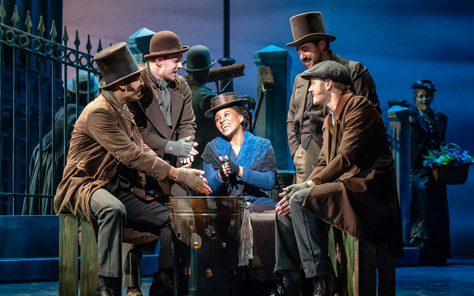 Actors in period costumes perform a scene from "My Fair Lady" on stage.