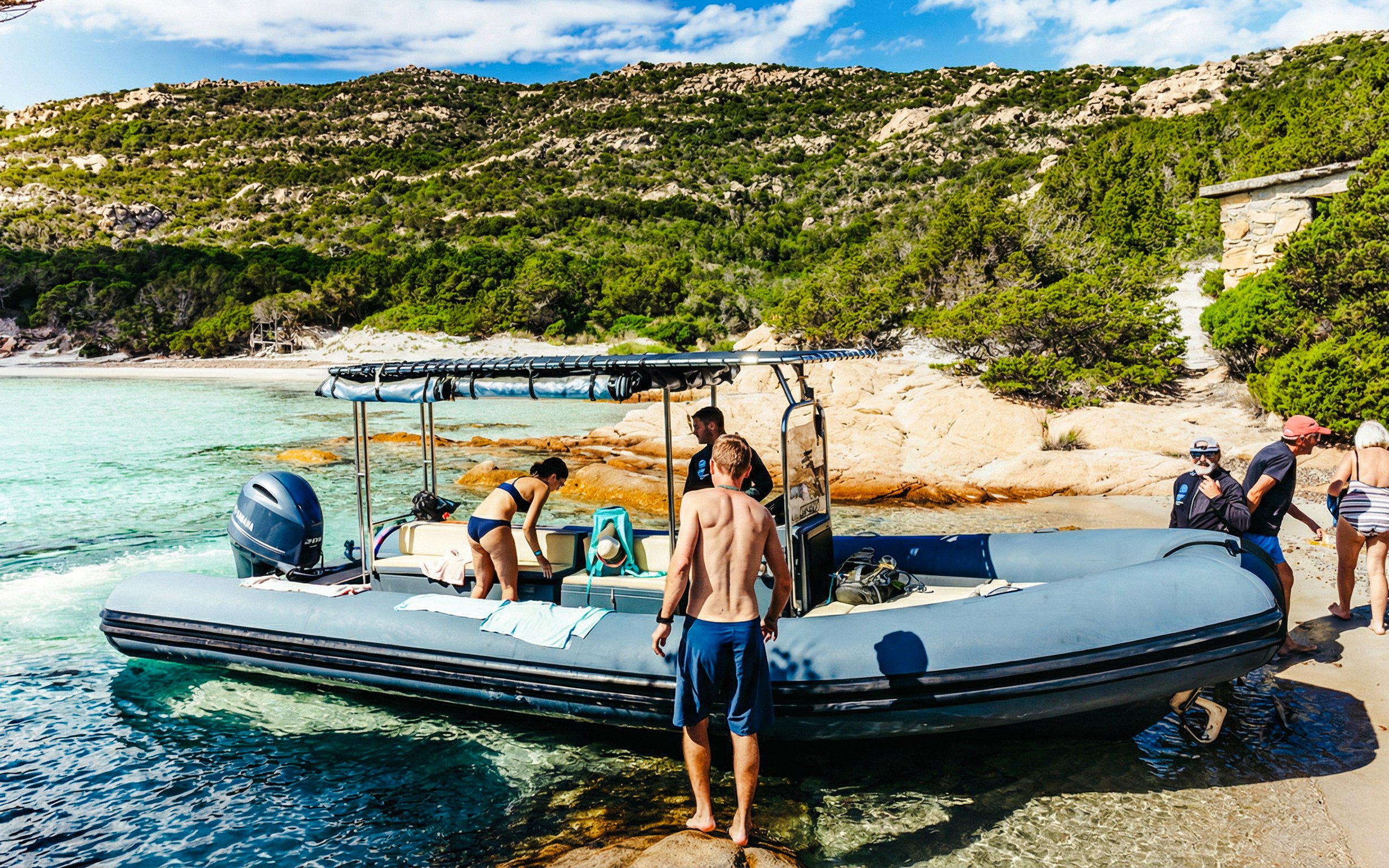 Tourists boarding a RIB boat at La Maddalena Archipelago, Italy.