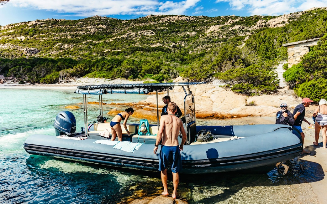 Tourists boarding a RIB boat at La Maddalena Archipelago, Italy.