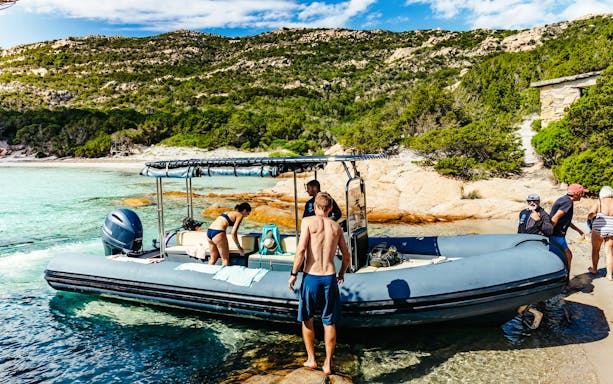 Tourists boarding a RIB boat at La Maddalena Archipelago, Italy.