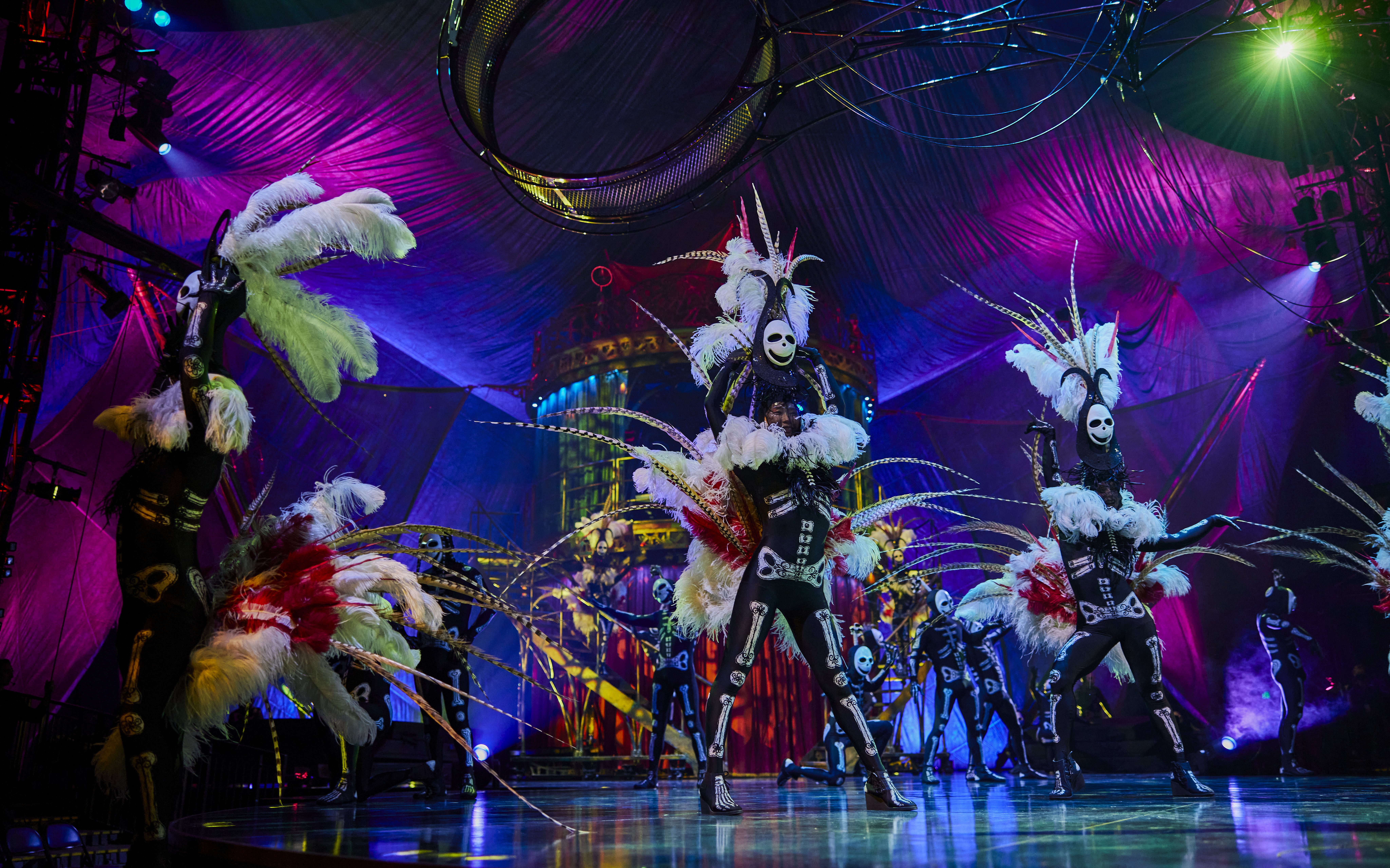 Performers in elaborate costumes on stage during Kooza show in Brisbane.
