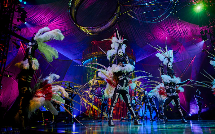 Performers in elaborate costumes on stage during Kooza show in Brisbane.