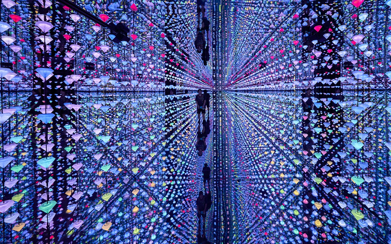 Matrix installation by Studio Irma at Moco Museum, Barcelona, featuring colorful hanging lights.
