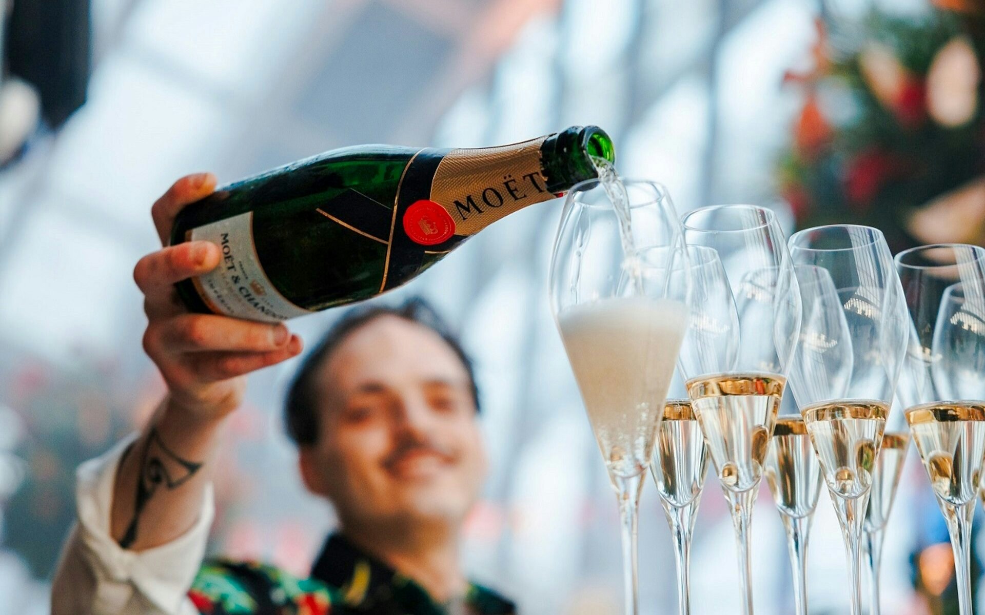 Pouring champagne at Sky Garden Music Night, London.