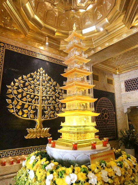 Golden pagoda and intricate wall art at Sun World Fansipan Legend, Vietnam.