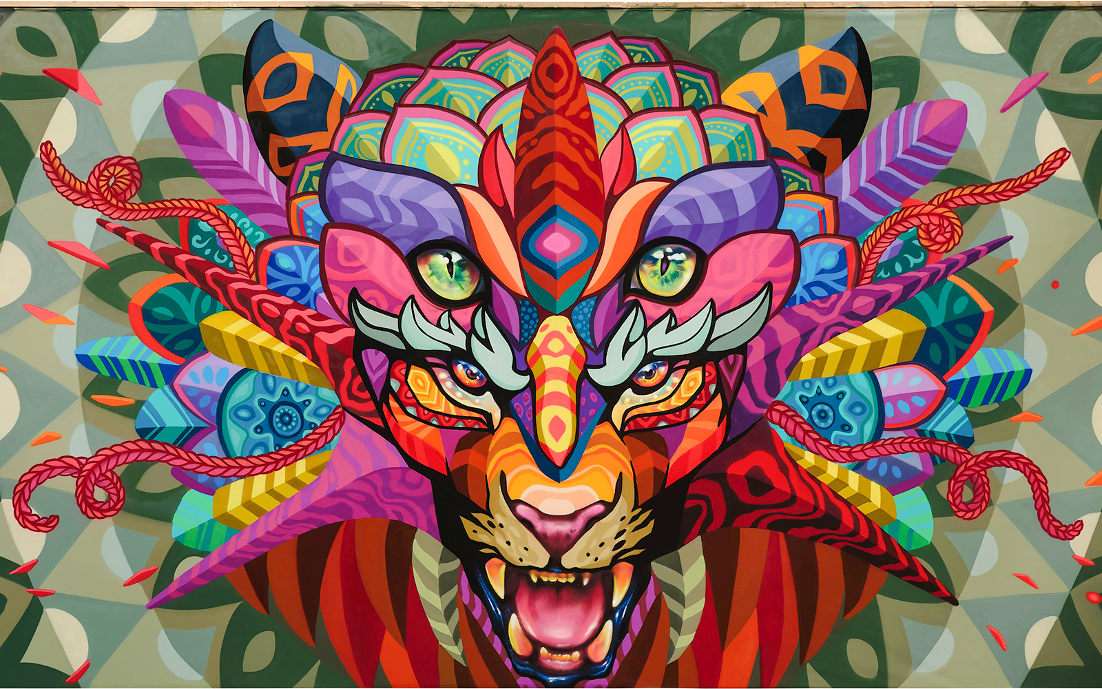 Colorful mural of a stylized tiger face by Farid Rueda, featuring vibrant geometric patterns.