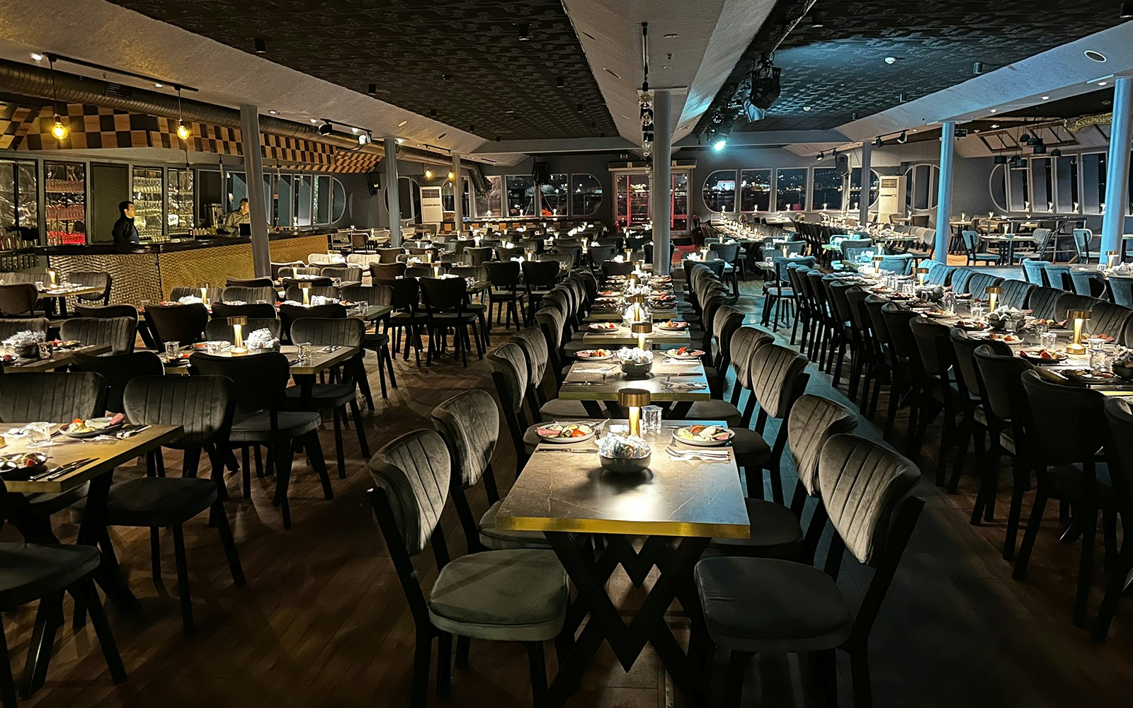 Dining setup for Bosphorus 3-Course Dinner Cruise with Oriental Show, featuring elegantly arranged tables.