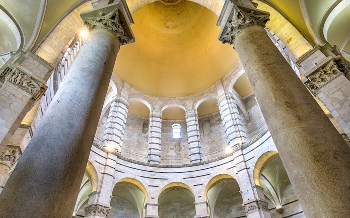 Pillars and arches inside the Pisa Baptistery, Italy.