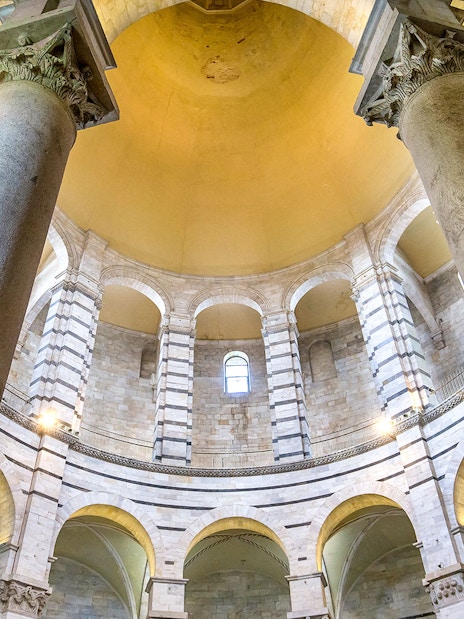 Pillars and arches inside the Pisa Baptistery, Italy.