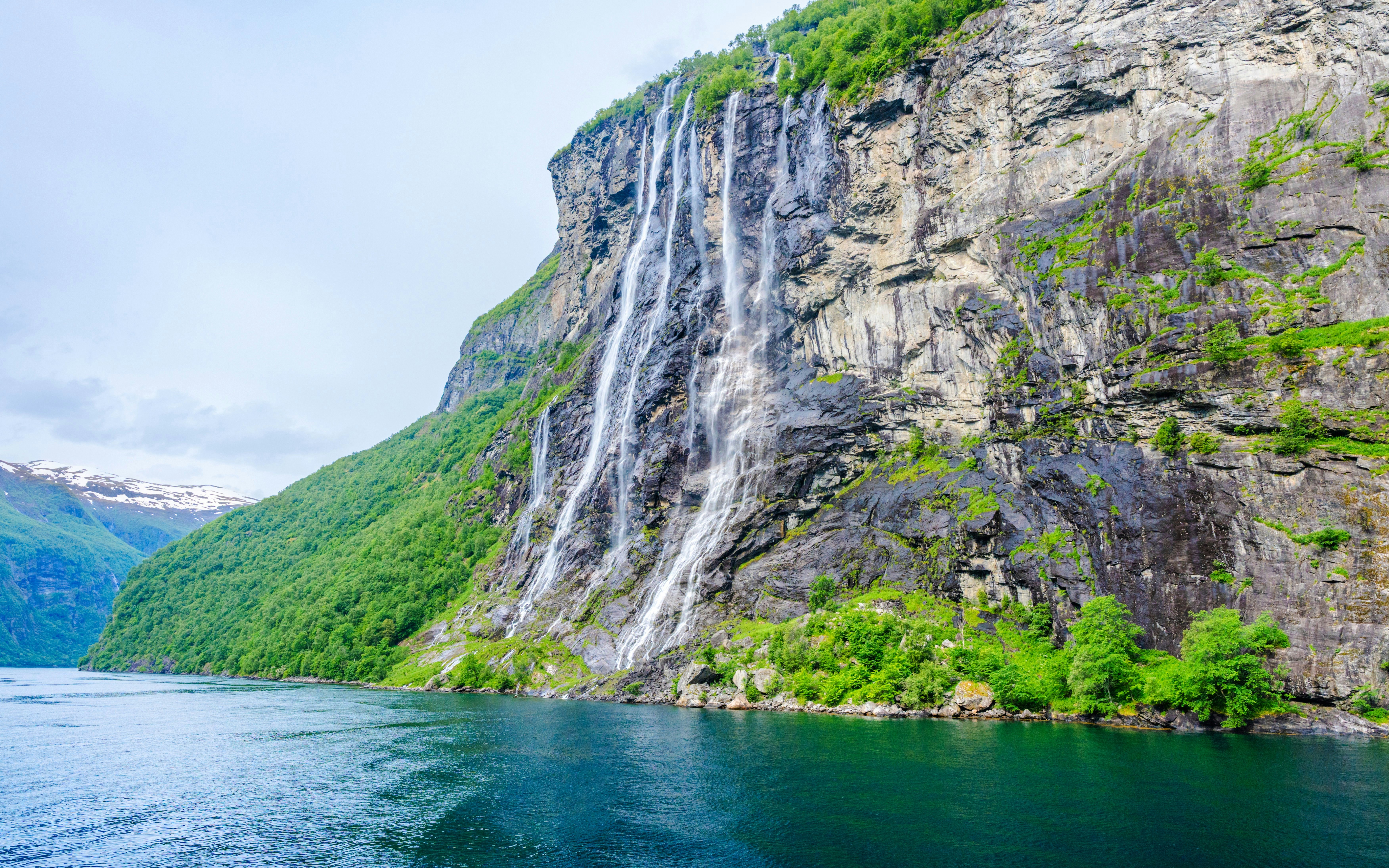 Seven Sisters waterfall cascading down a cliff in Geiranger, Norway.