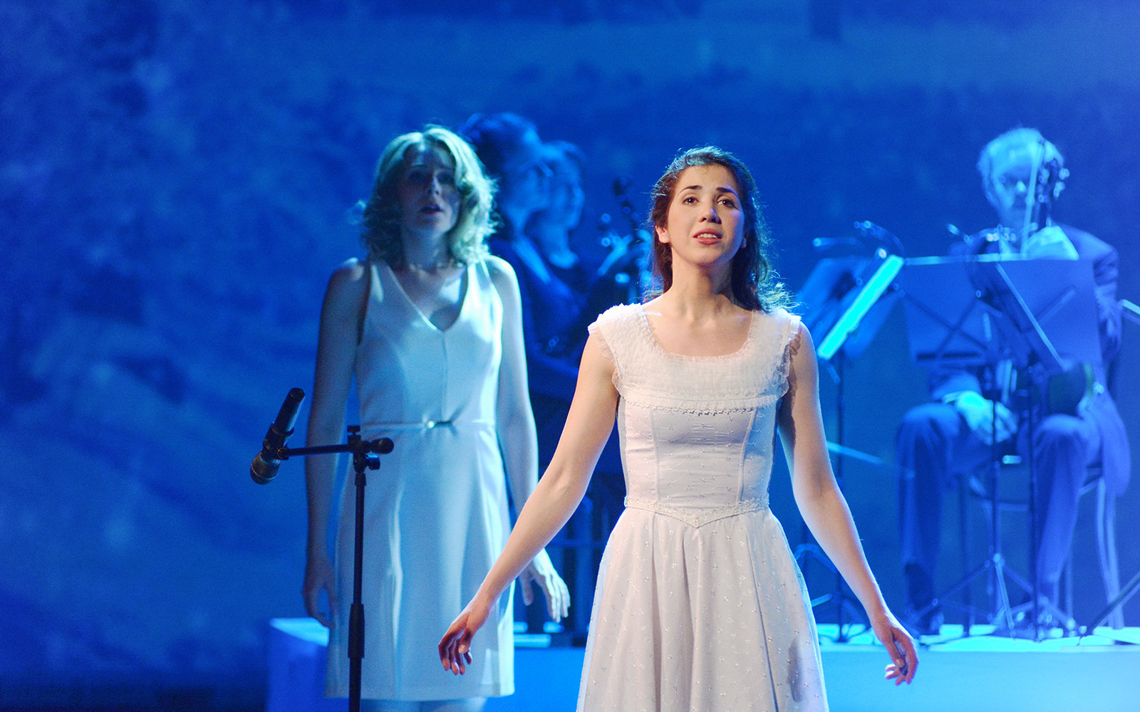 Opera singers performing on stage in Rome.