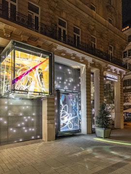 Swarovski House entrance with illuminated displays in Vienna.