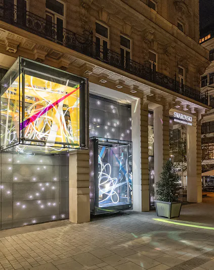 Swarovski House entrance with illuminated displays in Vienna.