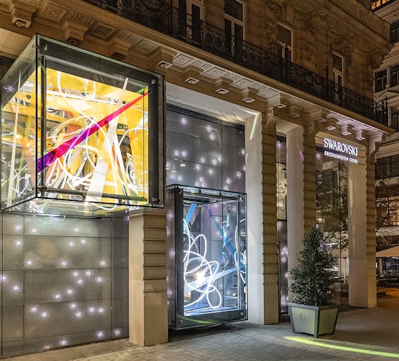 Swarovski House entrance with illuminated displays in Vienna.