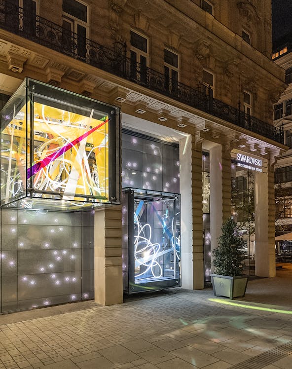 Swarovski House entrance with illuminated displays in Vienna.