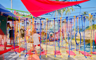 Child navigating rope course at Ko Fun Kids Rope Park, Phuket.