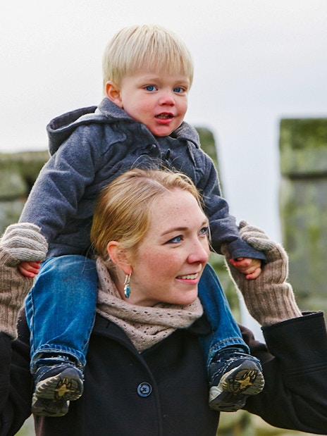 Mother and child visiting Stonehenge, England.