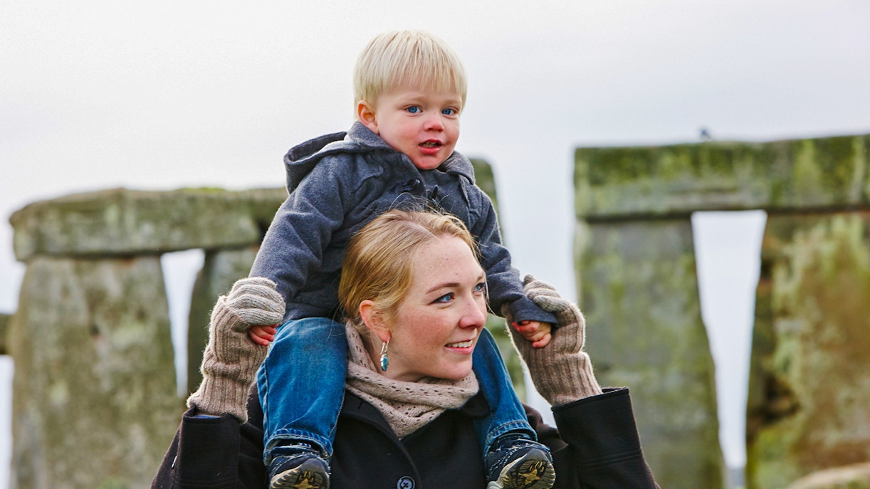 Mother and child visiting Stonehenge, England.