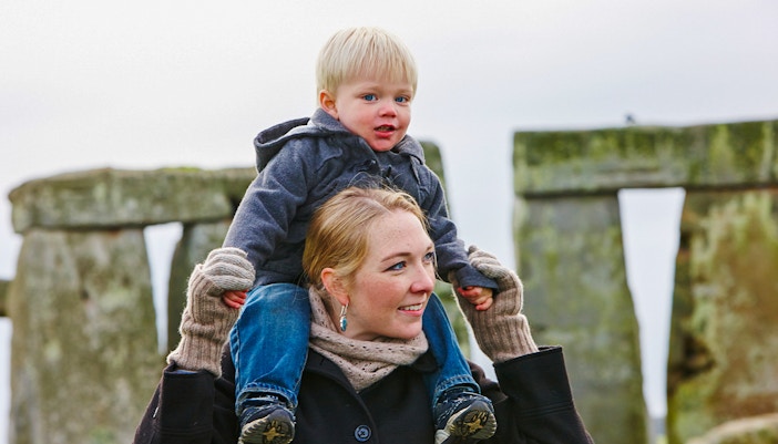 Mother and child visiting Stonehenge, England.