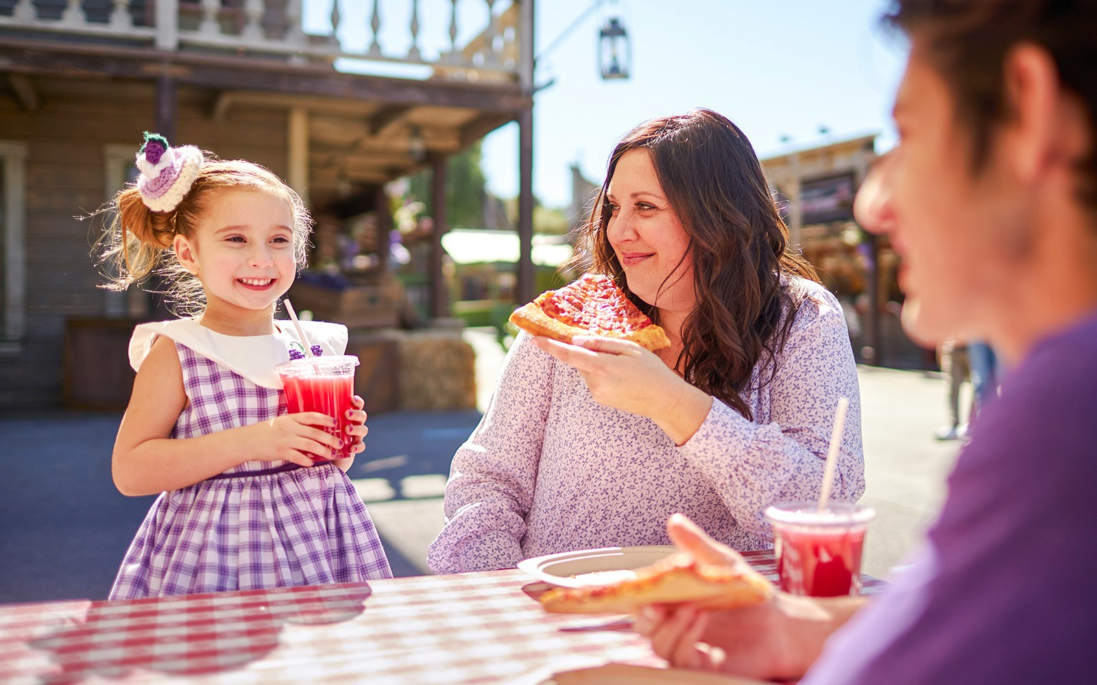 Family enjoying boysenberry treats at Knott's Boysenberry Festival, Knott's Berry Farm.