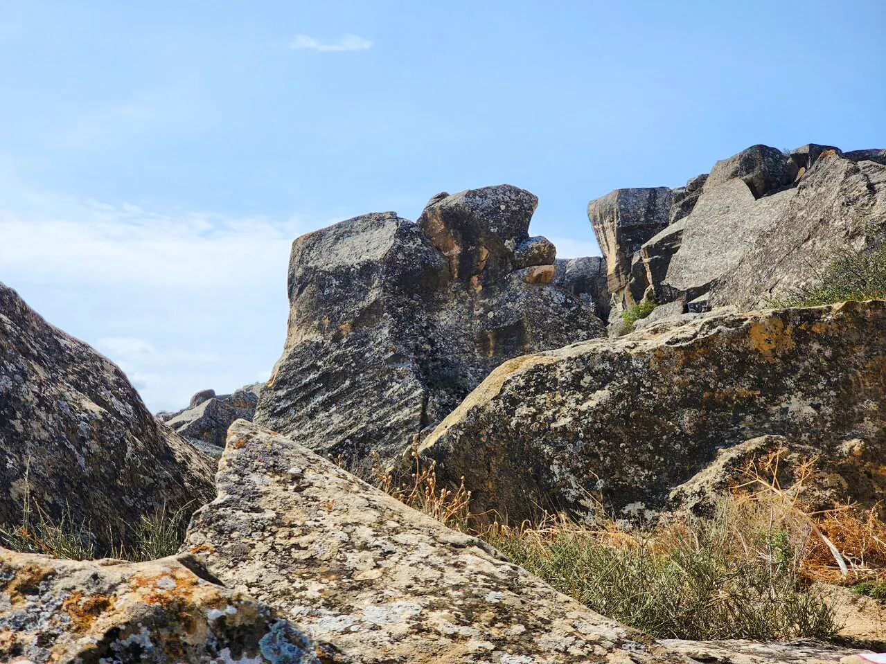 Gobustan rock formations under blue sky, Baku, Azerbaijan.