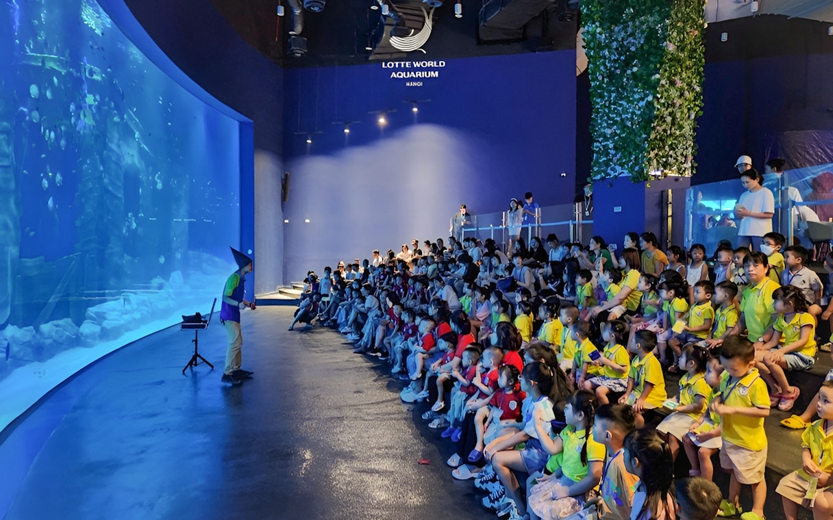 Audience watching a presentation at Lotte World Aquarium Hanoi.