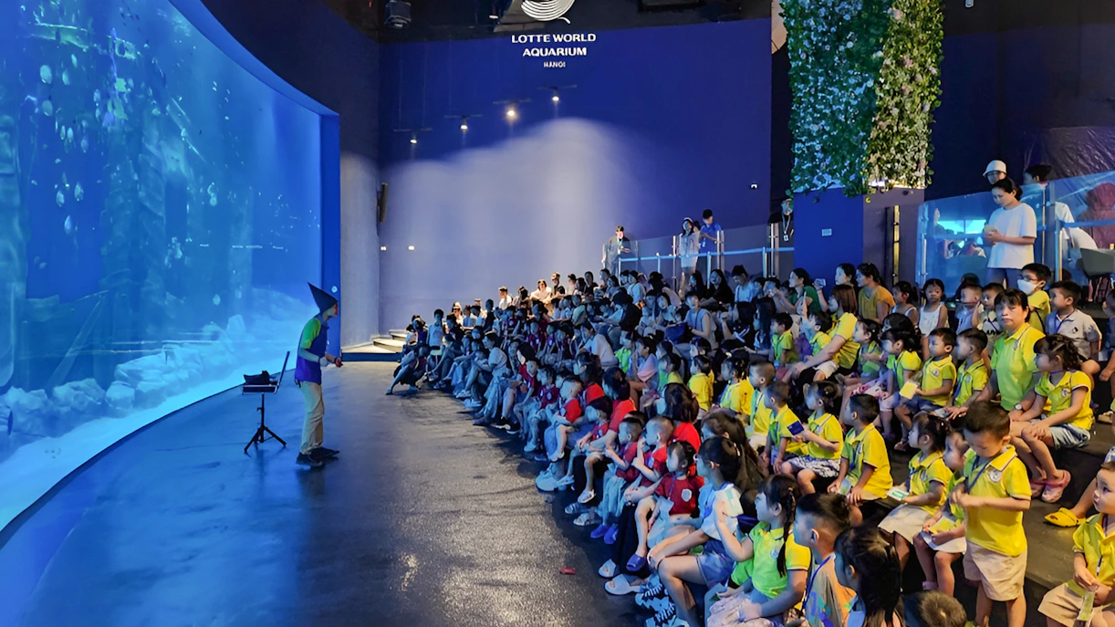 Audience watching a presentation at Lotte World Aquarium Hanoi.