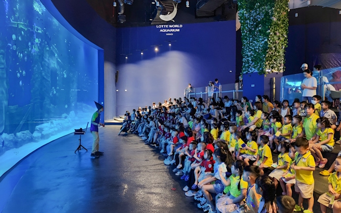 Audience watching a presentation at Lotte World Aquarium Hanoi.