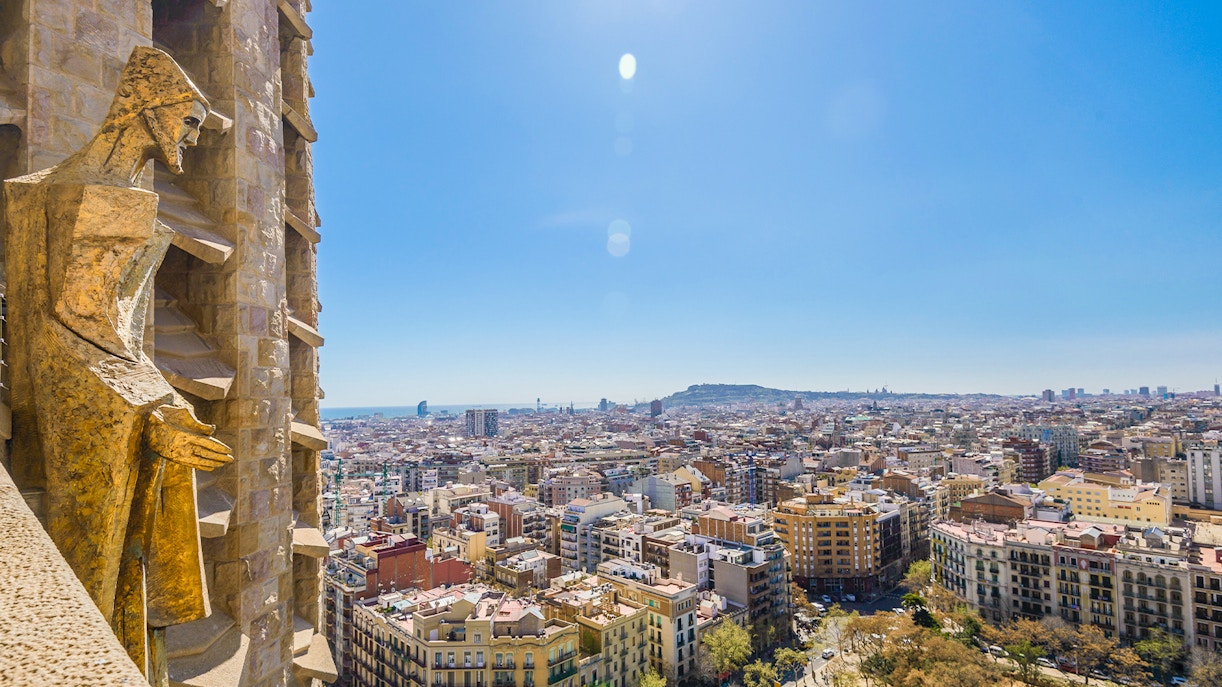 Barcelona cityscape from Sagrada Familia tower, highlighting iconic architecture and urban layout.