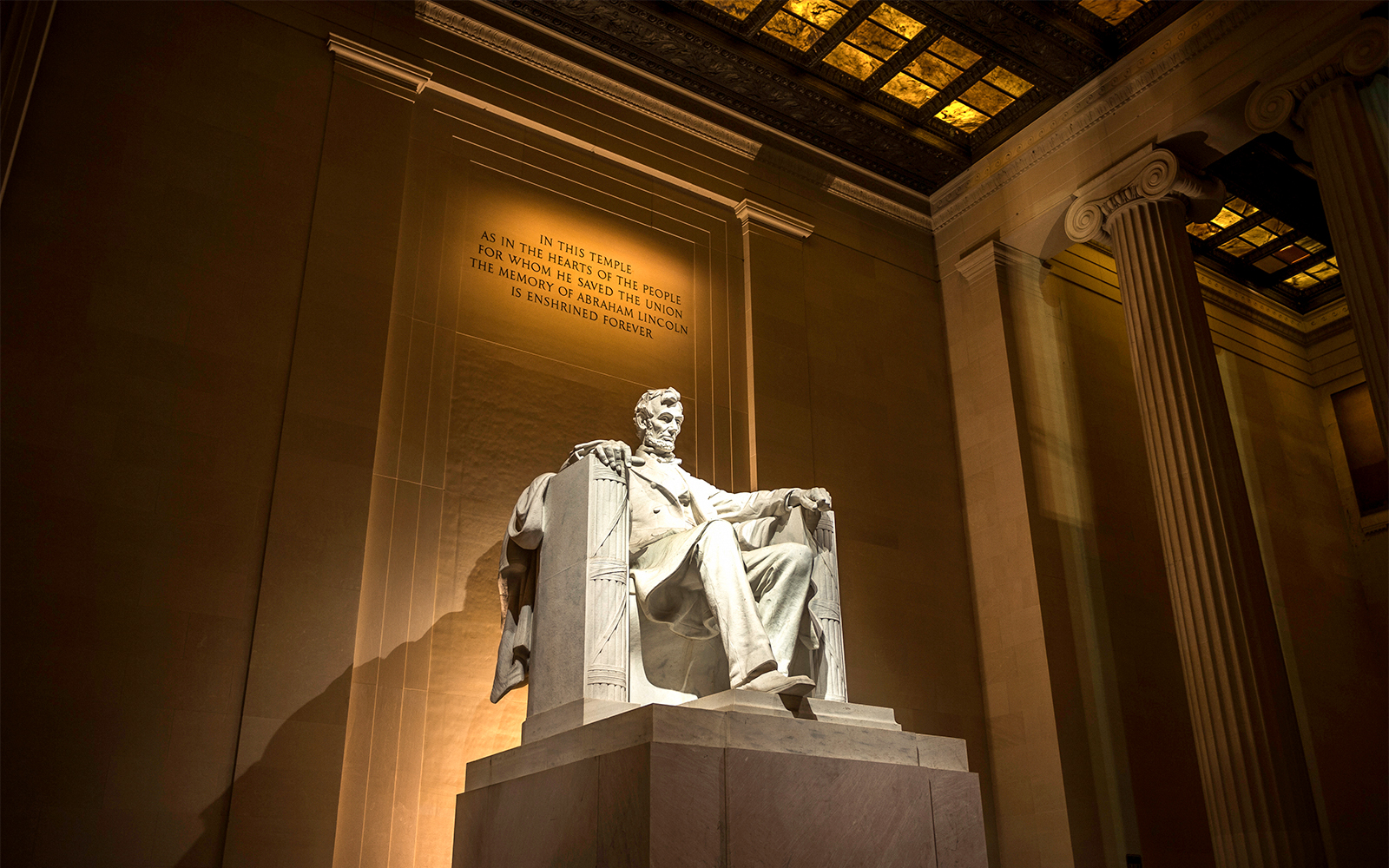 Lincoln Memorial statue illuminated at night in Washington D.C.