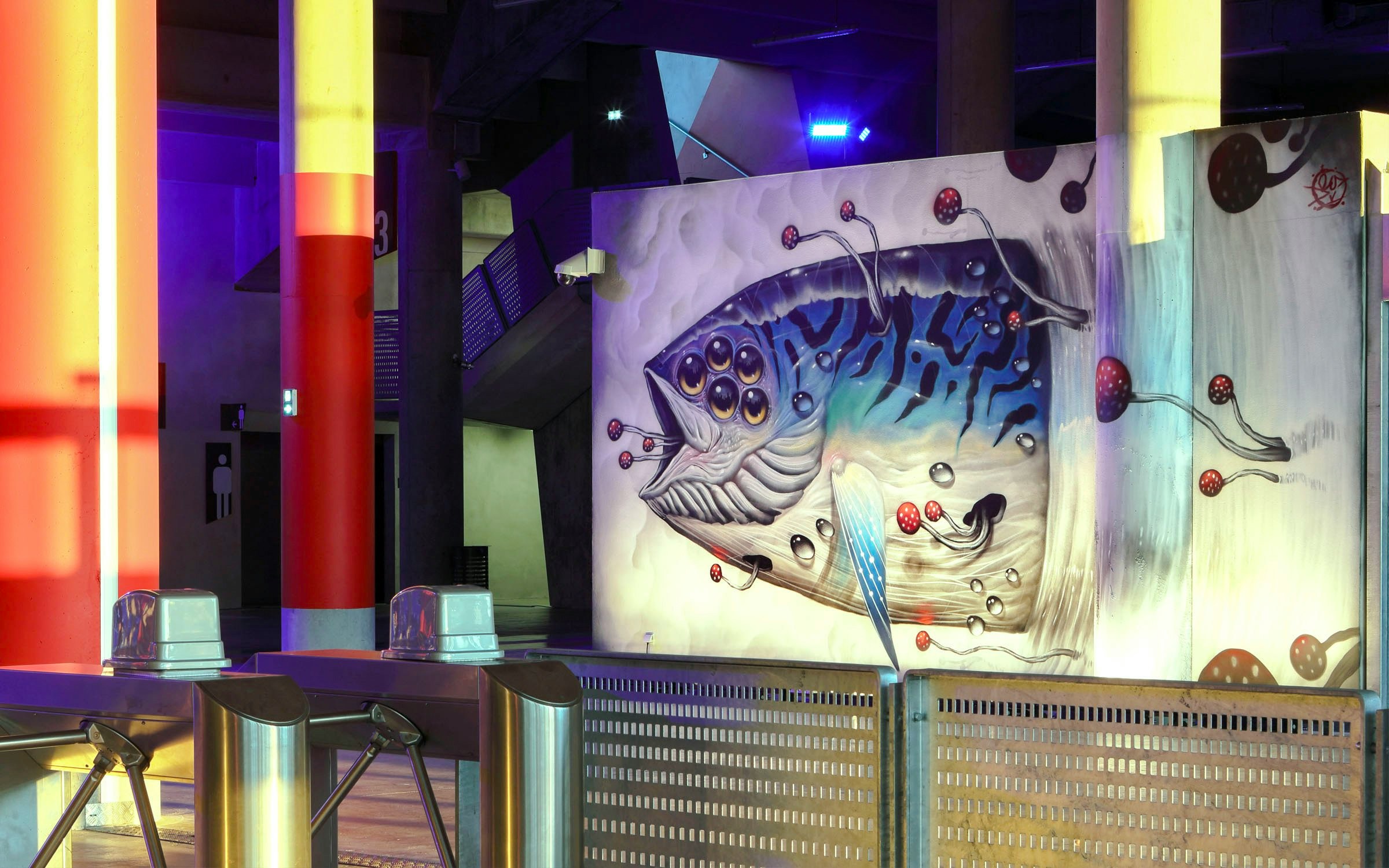 Mural of a fish with multiple eyes at Offside Gallery, Olympique Lyonnais Groupama Stadium.
