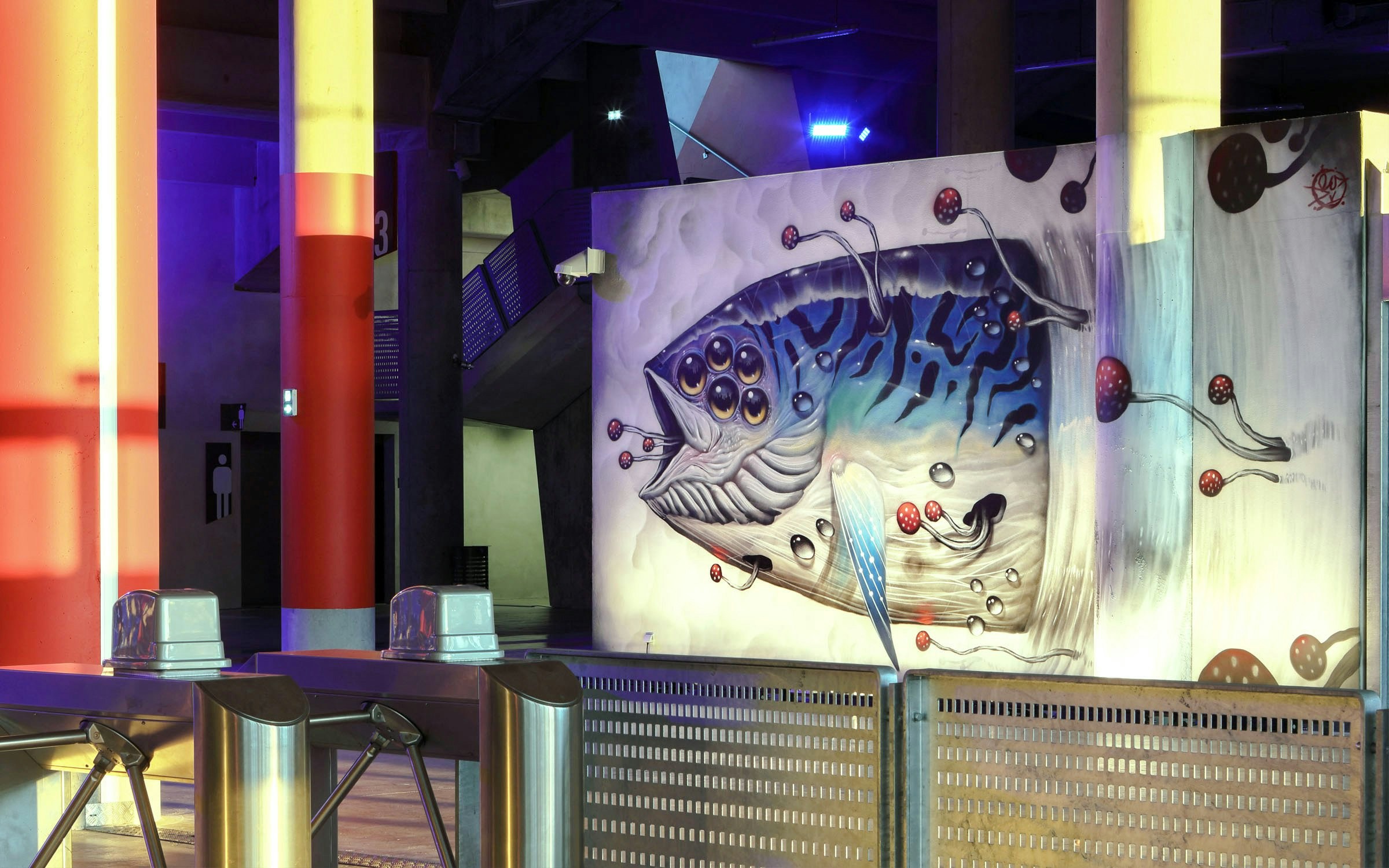 Mural of a fish with multiple eyes at Offside Gallery, Olympique Lyonnais Groupama Stadium.