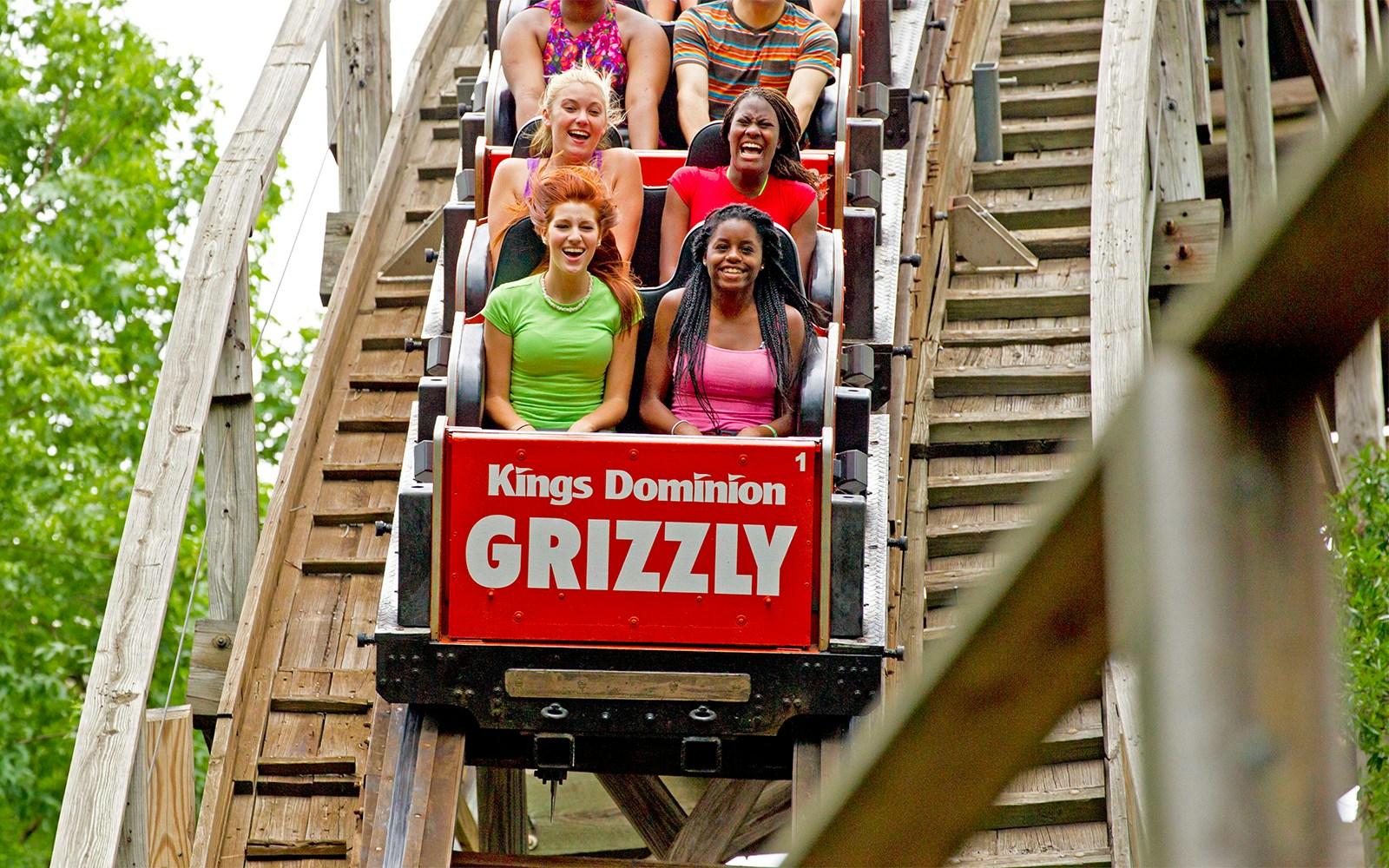 Riders enjoying the Grizzly roller coaster at Six Flags King's Dominion.