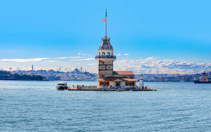Maiden’s Tower on the Bosphorus with Istanbul skyline in the background, Turkey.