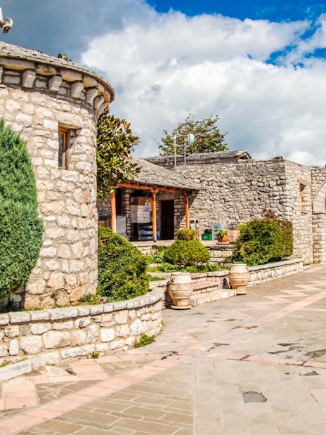 Stone courtyard and archway at Lekursi Castle in Saranda, Albania.