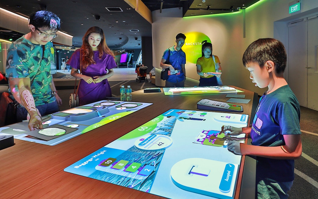Visitors interacting with digital exhibits at Petrosains, The Discovery Center.