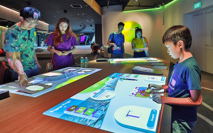 Visitors interacting with digital exhibits at Petrosains, The Discovery Center.