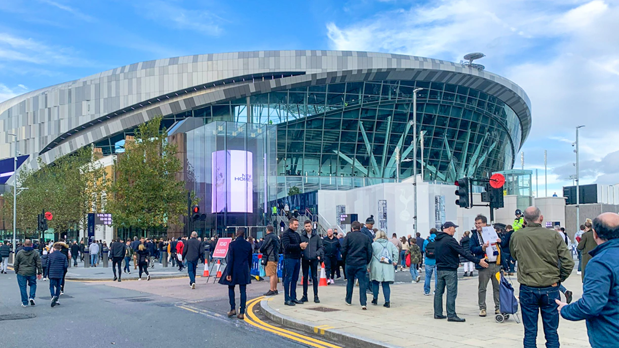 Tottenham Hotspur Stadium interior view with seating and field in London.