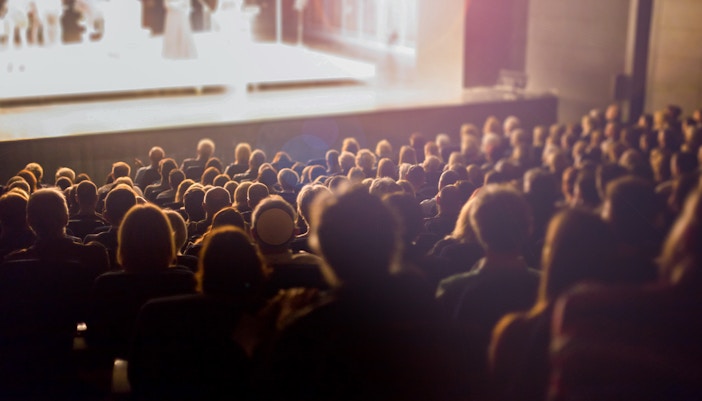 Audience watching a film at the Kraków Film Festival.